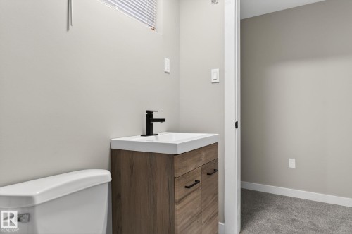 Bathroom featuring vanity and light carpet - 5 Langley Drive, Fort Saskatchewan, AB - Indoor Photo Showing Bathroom