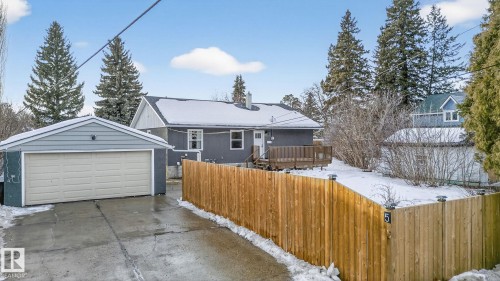 View of front of property with an outdoor structure and a detached garage - 5 Langley Drive, Fort Saskatchewan, AB - Outdoor