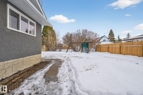 Snowy yard featuring a playground and a fenced backyard - 5 Langley Drive, Fort Saskatchewan, AB - Outdoor