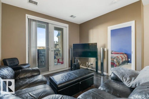 217 6083 Maynard Way, Edmonton, AB - Indoor Photo Showing Living Room