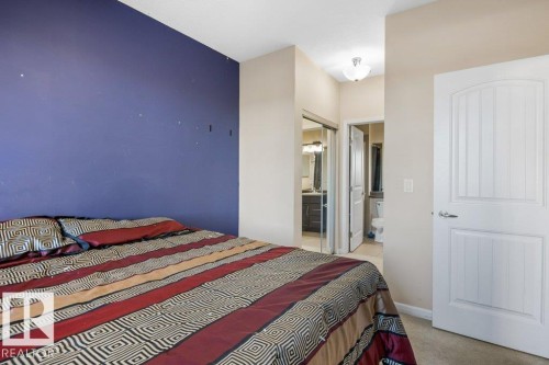 217 6083 Maynard Way, Edmonton, AB - Indoor Photo Showing Bedroom