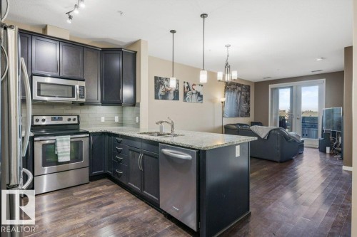 217 6083 Maynard Way, Edmonton, AB - Indoor Photo Showing Kitchen With Stainless Steel Kitchen With Double Sink With Upgraded Kitchen