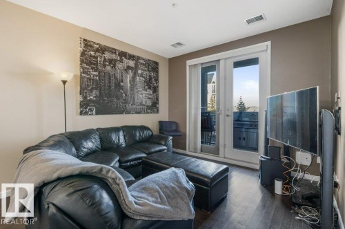 217 6083 Maynard Way, Edmonton, AB - Indoor Photo Showing Living Room