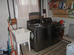 Laundry room with washing machine and clothes dryer - 