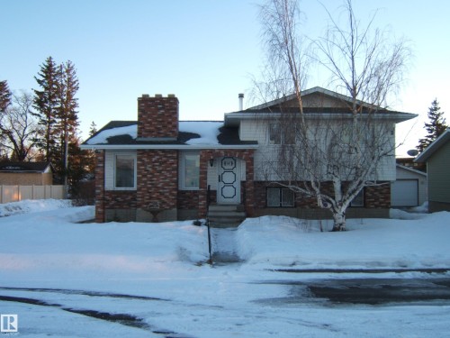 Tri-level home with a chimney and brick siding - 4807 54 Avenue, Two Hills, AB - Outdoor