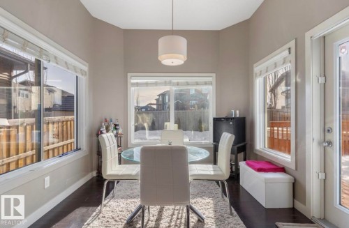 Dining space with dark wood-style flooring - 21703 86 Avenue, Edmonton, AB - Indoor Photo Showing Dining Room