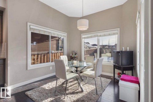 Dining space with baseboards and dark wood-style flooring - 21703 86 Avenue, Edmonton, AB - Indoor Photo Showing Dining Room