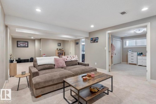 Carpeted living room with baseboards and recessed lighting - 21703 86 Avenue, Edmonton, AB - Indoor
