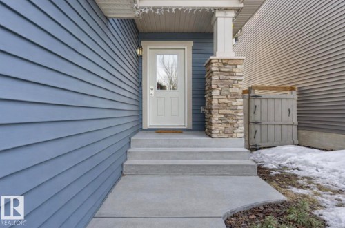 Property entrance with a gate - 21703 86 Avenue, Edmonton, AB - Outdoor With Exterior
