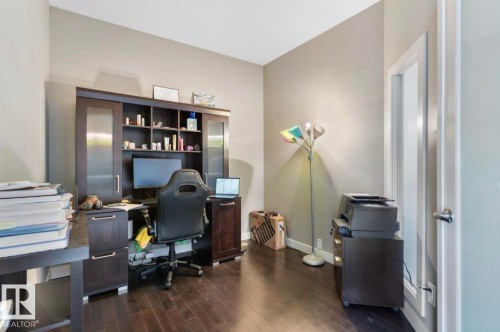 Office space with dark wood-style floors and baseboards - 21703 86 Avenue, Edmonton, AB - Indoor Photo Showing Office