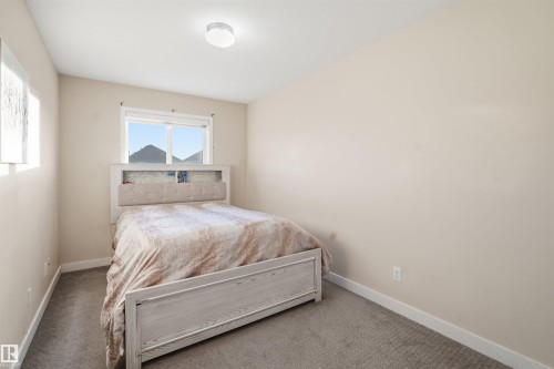 Bedroom with carpet - 8 230 Edwards Drive, Edmonton, AB - Indoor Photo Showing Bedroom