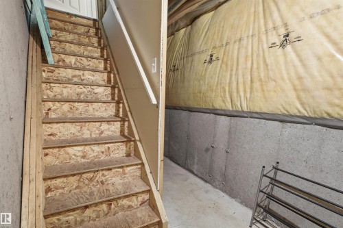 Stairway with concrete flooring - 8 230 Edwards Drive, Edmonton, AB - Indoor Photo Showing Other Room