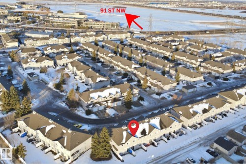 Aerial view of property's location with nearby suburban area - 8 230 Edwards Drive, Edmonton, AB - Outdoor With Body Of Water With View