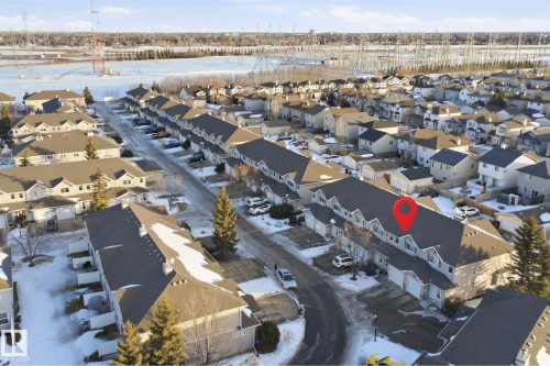 Aerial overview of property's location with nearby suburban area - 8 230 Edwards Drive, Edmonton, AB - Outdoor With View