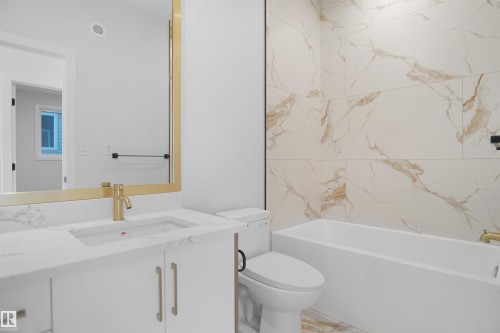 Bathroom featuring vanity and shower / bath combination - 6228 29 Avenue, Edmonton, AB - Indoor Photo Showing Bathroom