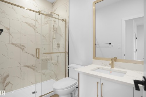 Bathroom featuring vanity and a marble finish shower - 6228 29 Avenue, Edmonton, AB - Indoor Photo Showing Bathroom