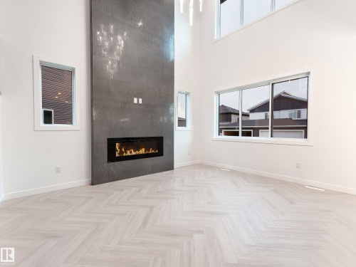 125 Lilac Close, Leduc, AB - Indoor Photo Showing Other Room With Fireplace