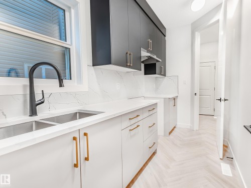 125 Lilac Close, Leduc, AB - Indoor Photo Showing Kitchen With Double Sink