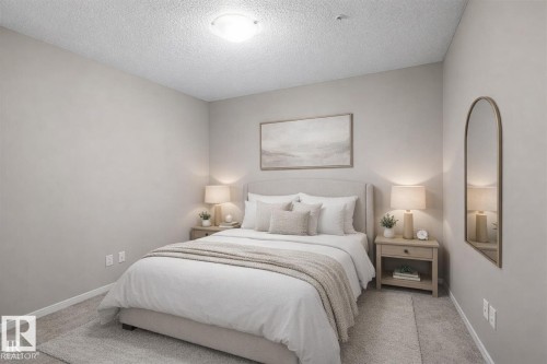 Virtually Staged - 208 5810 Mullen Place, Edmonton, AB - Indoor Photo Showing Bedroom