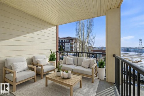 Virtually staged - 208 5810 Mullen Place, Edmonton, AB - Outdoor With Balcony With Exterior