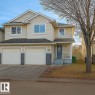 View of front of property featuring an attached garage and concrete driveway - 4 4350 23 Street, Edmonton, AB  - Outdoor With Facade 