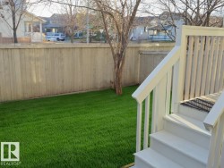 Fenced yard with a residential view - 