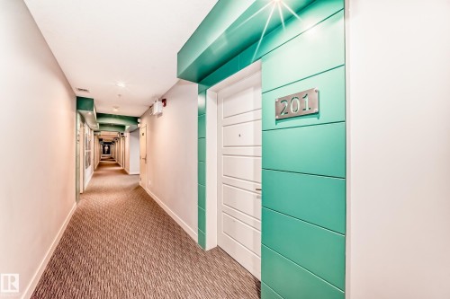 Hallway with carpet flooring and recessed lighting - 201 2588 Anderson Way, Edmonton, AB - Indoor Photo Showing Other Room