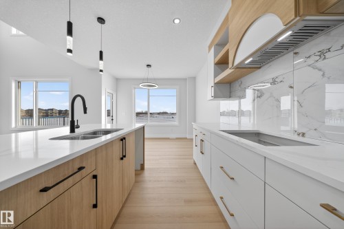 459 Crystal Creek Link, Leduc, AB - Indoor Photo Showing Kitchen With Double Sink With Upgraded Kitchen