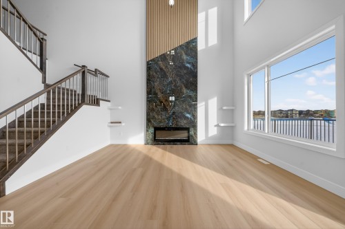 459 Crystal Creek Link, Leduc, AB - Indoor Photo Showing Other Room With Fireplace