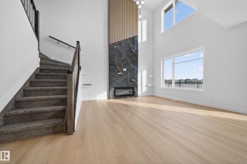 459 Crystal Creek Link, Leduc, AB - Indoor Photo Showing Other Room With Fireplace