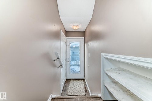 Doorway to outside with baseboards - 9332 211 Street Nw, Edmonton, AB - Indoor Photo Showing Other Room