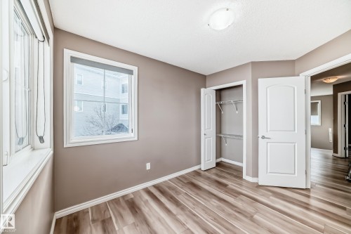 Unfurnished bedroom with a closet and light wood-style flooring - 9332 211 Street Nw, Edmonton, AB - Indoor Photo Showing Other Room