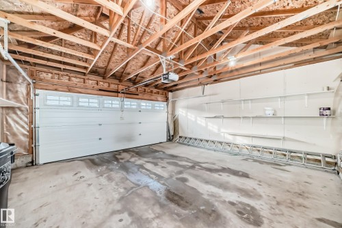 Garage featuring a garage door opener - 9332 211 Street Nw, Edmonton, AB - Indoor Photo Showing Garage