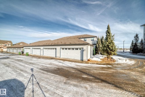 View of property exterior featuring roof with shingles - 9332 211 Street Nw, Edmonton, AB - Outdoor
