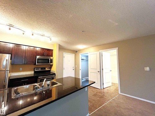 203 5390 Chappelle Road Sw, Edmonton, AB - Indoor Photo Showing Kitchen With Double Sink