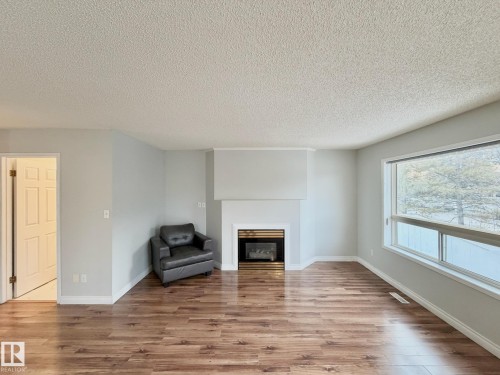 2 3311 58 Street, Edmonton, AB - Indoor Photo Showing Living Room With Fireplace