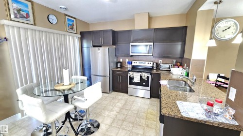 40 13003 132 Avenue, Edmonton, AB - Indoor Photo Showing Kitchen With Stainless Steel Kitchen With Double Sink With Upgraded Kitchen
