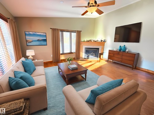 *virtually staged - 28 52327 Rge Road 20, Rural Parkland County, AB - Indoor Photo Showing Living Room With Fireplace