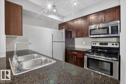 213 5390 Chappelle Road, Edmonton, AB - Indoor Photo Showing Kitchen With Double Sink