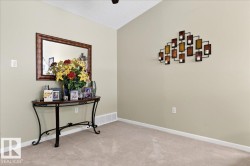 Interior space with carpet and a textured ceiling - 