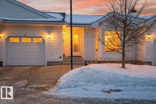 View of front of house featuring a garage and driveway - 13217 155 Avenue Nw, Edmonton, AB - Outdoor