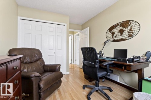 Home office featuring light wood finished floors and a textured ceiling - 13217 155 Avenue Nw, Edmonton, AB - Indoor Photo Showing Office