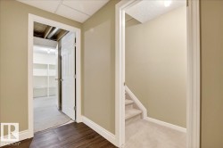 Corridor featuring baseboards and carpet floors - 