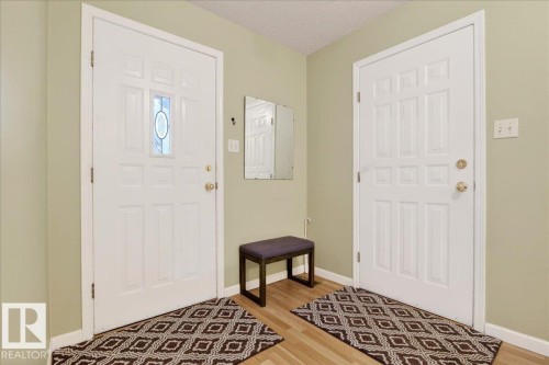 Entryway featuring a textured ceiling and light wood-type flooring - 13217 155 Avenue Nw, Edmonton, AB - Indoor Photo Showing Other Room