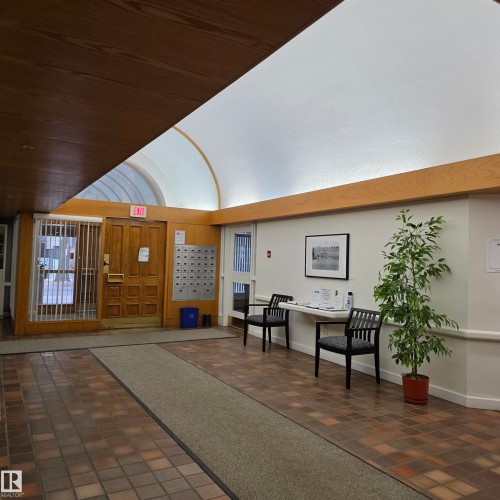 Community lobby with a vaulted wood ceiling - 2C 10050 118 Street, Edmonton, AB - Indoor Photo Showing Other Room