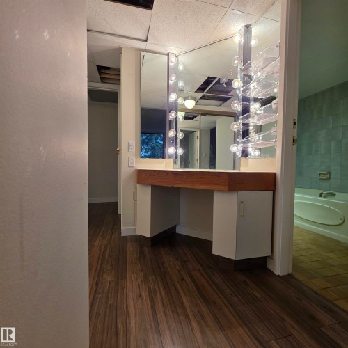 Full bathroom with dark wood finished floors, vanity, and a drop ceiling - 2C 10050 118 Street, Edmonton, AB - Indoor Photo Showing Other Room