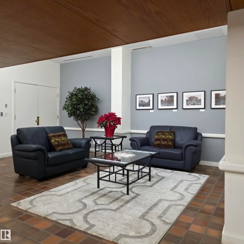 Living room featuring wood ceiling and baseboards - 2C 10050 118 Street, Edmonton, AB - Indoor Photo Showing Living Room