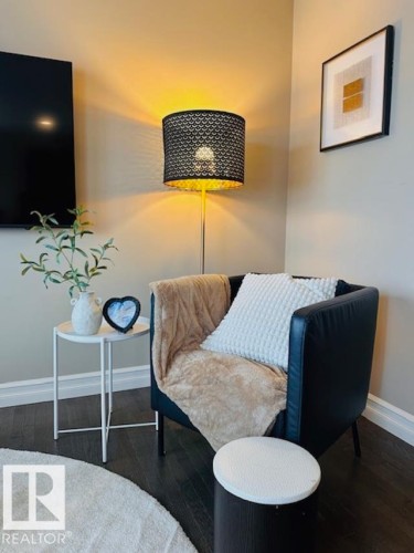 Bedroom with baseboards and dark wood-style floors - 12219 167A Avenue, Edmonton, AB - Indoor