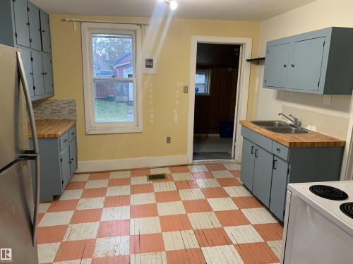 9747 90 Avenue, Edmonton, AB - Indoor Photo Showing Kitchen With Double Sink