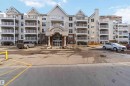 View of apartment building / complex with uncovered parking - 113 10311 111 Street, Edmonton, AB  - Outdoor With Facade 